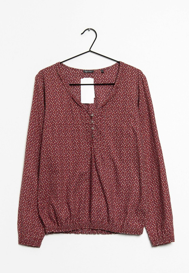 Blouse bordeaux à manches longues avec un décolleté en U, patte de boutonnage et taille élastique ; présente un petit motif floral sur l'ensemble.