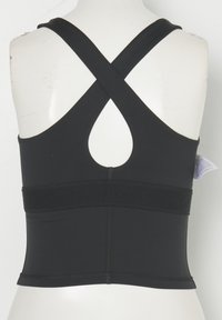 Haut noir sans manches avec bretelles croisées dans le dos et large bande élastique autour du milieu du dos sur un torse de mannequin blanc.