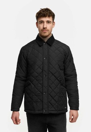 Zwarte gewatteerde jas met een corduroy kraag, voorste drukknoopsluiting, twee zijzakken en een gestructureerde stof.