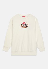 Sweat-shirt de couleur crème avec des manches longues, des poignets et un ourlet côtelés. Présente un logo imprimé coloré avec des accents floraux au centre.