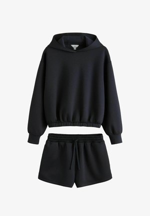 Black hooded sweatshirt with elastic hem paired with black elastic waist drawstring shorts, both made of soft fabric.