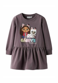 Lila långärmad klänning med gathered midja, tecknade karaktärer på framsidan och kattoverklighetsdetaljer på ärmarna.