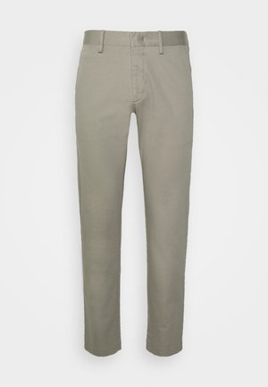 Light gray khaki trousers with a slim fit design, featuring a flat front, standard pockets, and a smooth fabric texture.