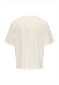 Bawełniany t-shirt w kremowym kolorze o luźnym kroju, krótkich rękawach i zaokrąglonym dekolcie, charakteryzujący się gładką fakturą bez widocznych wzorów.