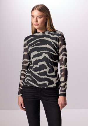 Haut ajusté à manches longues en noir avec un motif zèbre gris et des manches transparentes, présentant un col haut et une texture douce.