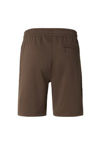 Bruine sportshorts gemaakt van zacht materiaal. Voorzien van een elastische tailleband, een achterzak en een naadloos ontwerp zonder zichtbare stiksels.