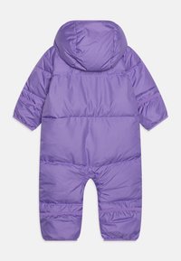Purple padded snowsuit with a hood. Features quilted design, long sleeves, and a loose fit. Smooth, shiny fabric with elasticized cuffs.