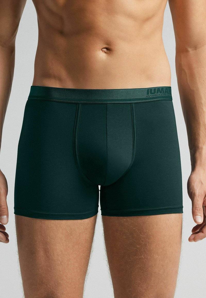 Mörkgröna boxerkalsonger med en åtsittande passform. Tillverkade av mjukt tyg, med en slät midjeband med logotyp och förstärka sömmar.