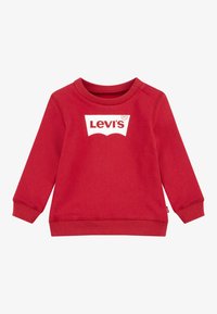 Rød sweatshirt med lange ermer, ribbede mansjetter og rund hals. Har en fremtredende hvit Levi's-logo foran. Laget av mykt materiale.
