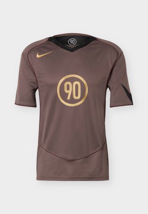 Brown short-sleeve sports jersey with gold "90" inside a circle on the chest, gold Nike swoosh on right shoulder, and black accents on sleeves.