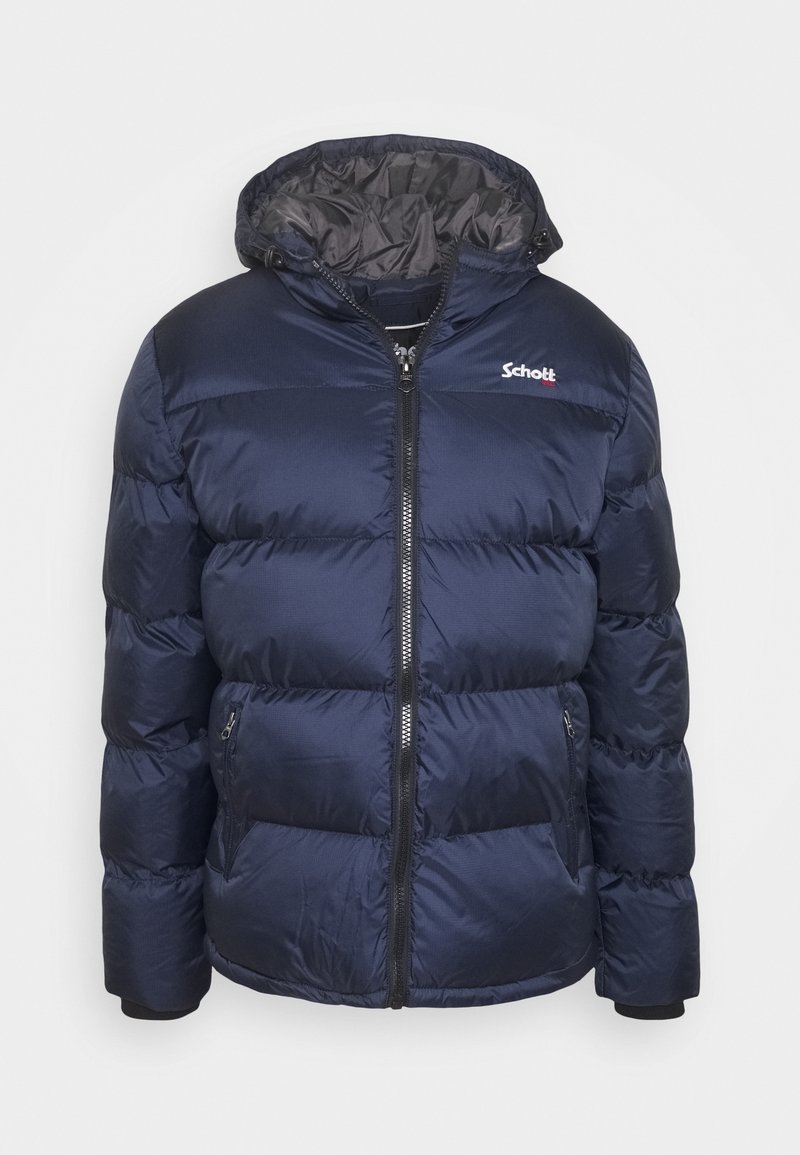 Marinblå puffjacka med dragkedja fram, huva och elastiska muddarna. Tillverkad av glänsande tyg med horisontell vaddering och sidofickor. Logotyp på bröstet.