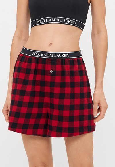 Crveni i crni karirani flanelasti šorts s crnim elastičnim pojasom koji sadrži logo "POLO RALPH LAUREN" i prednjim detaljem na dugme.