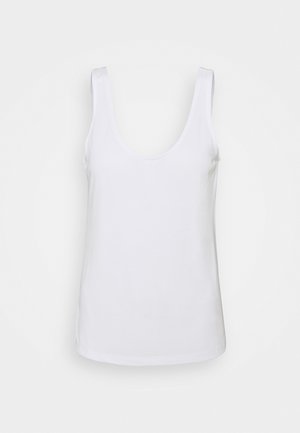 Débardeur blanc en coton, avec un décolleté en scoop, de larges bretelles et une texture lisse. L'ourlet est droit.