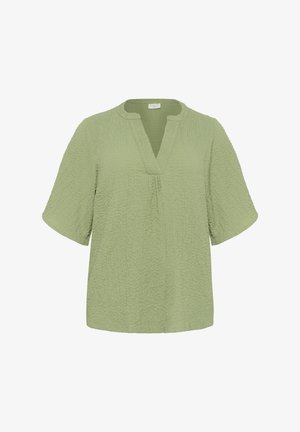 Šviesiai žalia, trumpų rankovių palaidinė su tekstūruotas paviršiumi, V formos iškirptė ir nedidelis pliečių detalė priekyje. Atsitiktinis, laisvas kirpimas.