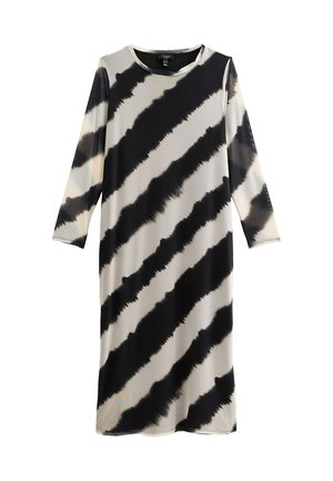 Vestido de manga larga en una tela ligera con un patrón de teñido anudado en negro y beige, con rayas diagonales y una silueta relajada.