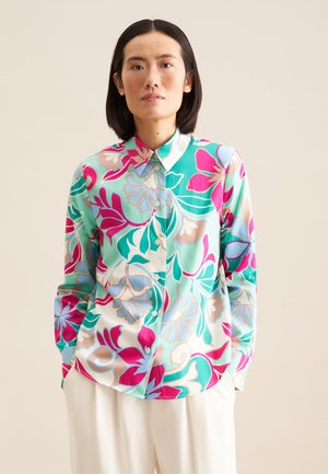 Floral button-up shirt featuring a mix of green, pink, and blue patterns on a white background; smooth fabric with a collared neckline.