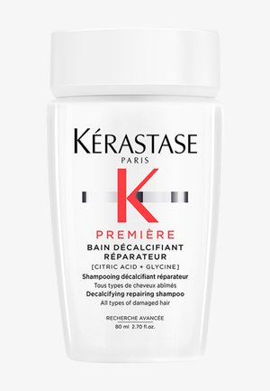 Fles Kérastase Première Decalcifying Repairing Shampoo voor alle soorten beschadigd haar, 80 ml, met citroenzuur en glycine.