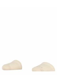 Chaussettes cheville beige en matériau doux et extensible, avec une texture lisse et un design bas, arborant un logo discret sur le côté.