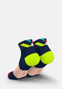 Colorful socks with a navy blue base, featuring neon green accents, geometric patterns, and a red toe. Made from a soft, breathable material.