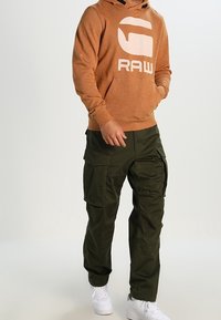 G-STAR Jersey con capucha - mustard yellow