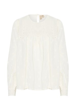 Weiße Bluse mit langen Ärmeln, Rundhalsausschnitt, strukturiertem Stoff, gestickten Details und Spitze an den Ärmeln. Schlüsselaugenöffnung hinten.