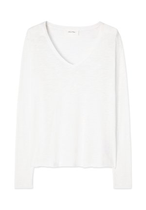 Valge pikkade varrukatega V-kaelusega kerge kampsun, millel on veidi lahtine lõige ja sirge alumine äär.