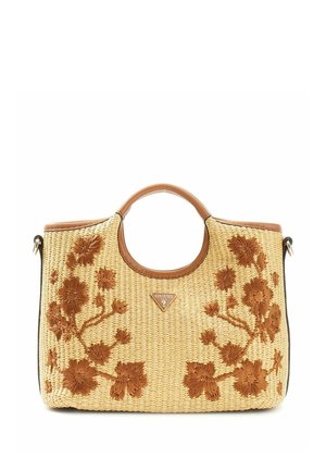 Sac à main en paille tressée avec anses rondes en cuir, broderie florale marron et petit logo triangulaire Guess au centre avant.