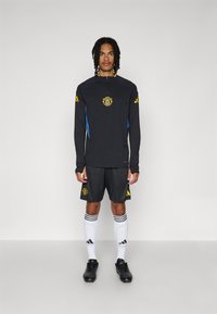 adidas Performance MANCHESTER UNITED 25/26 EUROPEAN PRO TRAINING TOP - Φανέλα τερματοφύλακα - black/blue/tribe yellow
