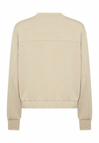 Beige long-sleeve sweatshirt with a rounded neckline, ribbed cuffs, and waistband; features a horizontal seam across the upper back.