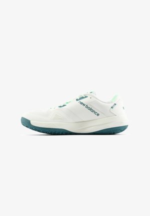 White athletic shoe with teal accents, featuring a textured sole, breathable mesh upper, and lace-up design. Brand name displayed on the side.