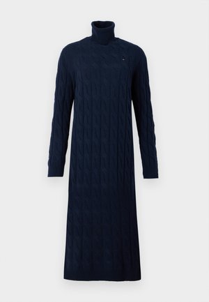 Mørkeblå, langærmet kabelstrik turtleneck kjole med ribbet manchetter og kant, med et lille logo på brystet.