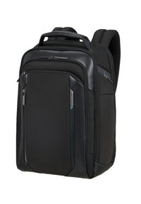 Zaino ergonomico nero con spallacci imbottiti, molteplici scomparti con cerniera e una robusta maniglia superiore per il trasporto.