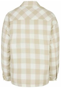 Camicia di flanella a quadri beige e bianca, con colletto classico, maniche lunghe e dettaglio sul retro. Tessuto morbido con polsini abbottonati.