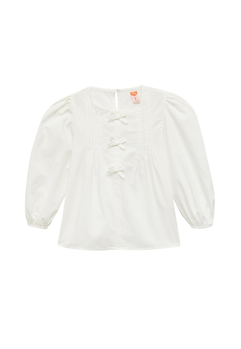 Blusa blanca con mangas abullonadas, cierres de botón con lazo, detalles plisados en la parte delantera y escote redondo. Material de algodón suave.
