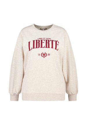 Lichtbeige sweatshirt met een ronde halslijn, ballonmouwen en rode tekst "LIBERTÉ" met bloemaccenten en het jaartal 1989.