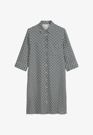 Chemise à boutons avec un motif géométrique dans des teintes de bleu, noir et jaune. Elle possède un col et des manches trois-quarts.