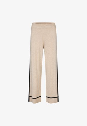 Pantaloni cropped beige con vita elastica, dotati di strisce laterali nere e bordi neri all'orlo. Tessuto morbido e strutturato.