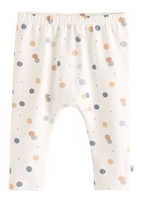 Leggings blancos de tela suave, con círculos dispersos en naranja, azul y negro. Cintura elástica para un fácil ajuste.