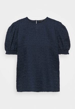 Navy blue textured blouse with puffed short sleeves, round neckline, and gathered elastic cuffs.