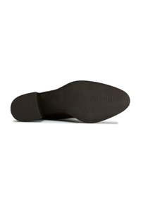 Black rubber shoe sole with ridged texture, featuring a rounded toe and flat heel. Imprinted brand detail near the heel area.