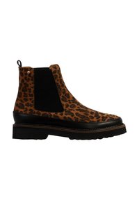 Bottine Chelsea avec dessus imprimé léopard marron et noir, panneau latéral élastique noir, semelle noire et languette à l'arrière.
