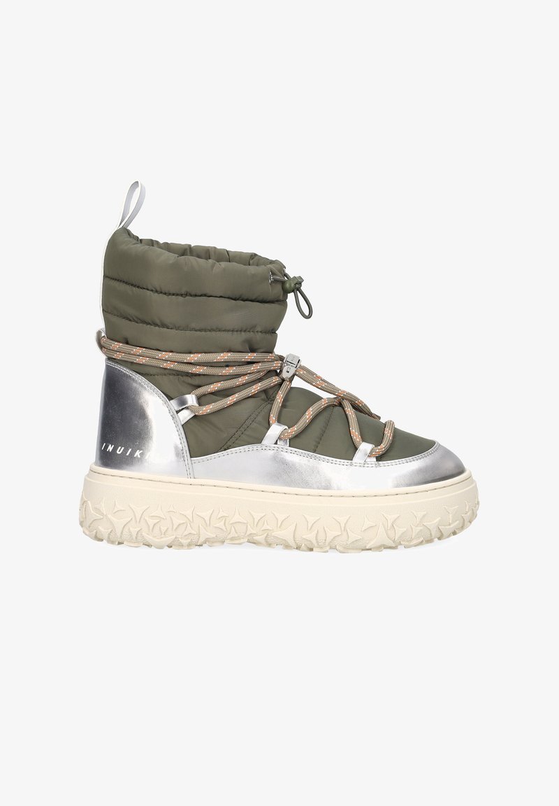 Green puffy ankle boot with silver accents, textured sole, and patterned laces. Features a plush upper and thick, rubberized outsole.