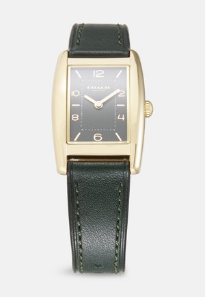 Rektangulär klocka i guldton med ett mörkgrönt läderarmband. Svart urtavla med vita timmarkörer och guldvisare. Krona på sidan.