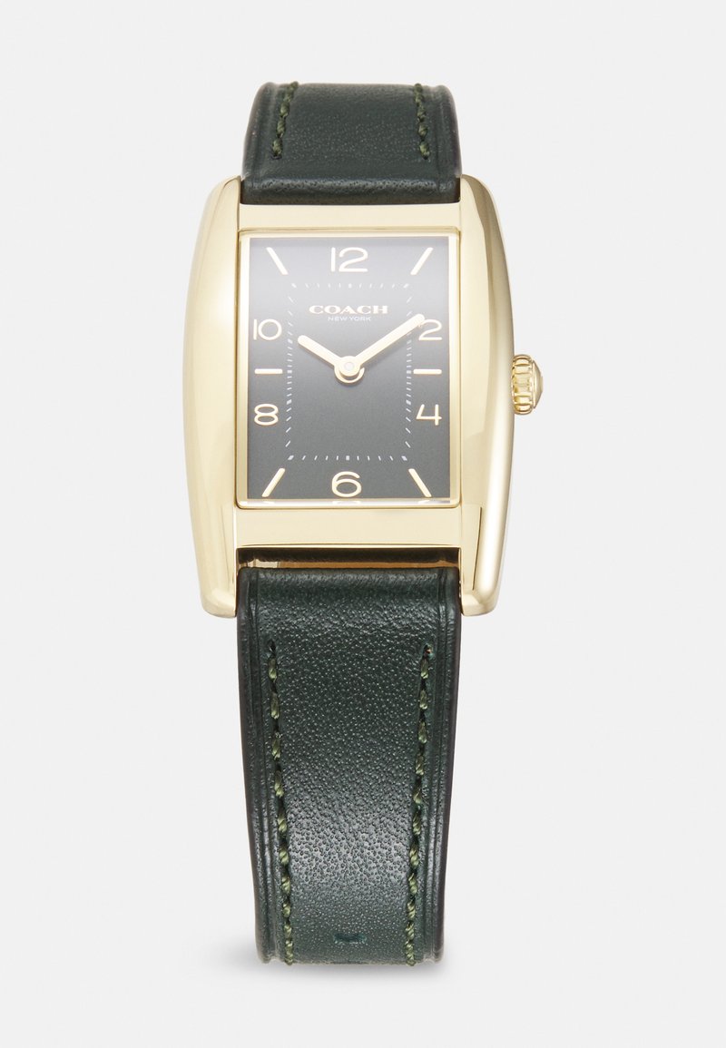 Rektangulär klocka i guldton med ett mörkgrönt läderarmband. Svart urtavla med vita timmarkörer och guldvisare. Krona på sidan.