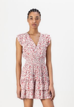 Floral dress with a V-neckline, short ruffled sleeves, smocked waist, and layered skirt in light pink and white with red accents.