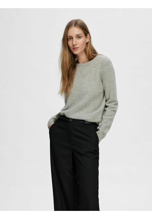 Light gray sweater with a round neckline, long sleeves, and a soft texture, paired with high-waisted black trousers and a thin black belt.