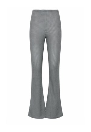 Højttaljede, sort-hvide bukser med dogstooth-mønster, udvidede ben med en slank pasform gennem lårene og bredere benåbninger.