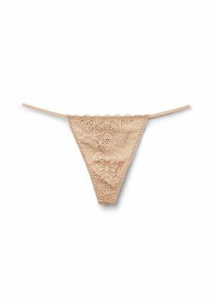 Lace thong in nude color, featuring a floral pattern, scalloped edges, and thin straps for minimal coverage. Lightweight texture.