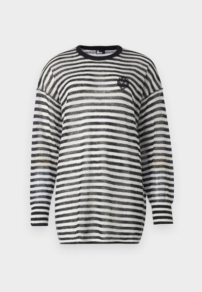 Striped sweater with wide black and white stripes, crew neck, dropped shoulders, and ribbed cuffs. Features a small embroidered emblem.