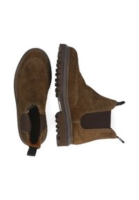 Botas Chelsea de ante marrón con paneles laterales elásticos, suela de goma texturizada y detalle de costura en contraste a lo largo de los bordes superiores.